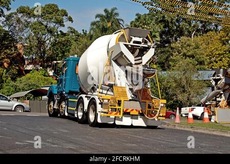 March 30. 2021. Cement truck delivering to the building site with bushland backdrop. New social housing residential units at 56 Beane St, Gosford. Stock Photo