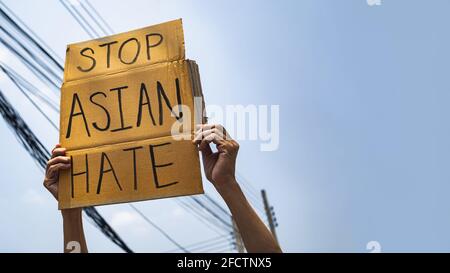A man holding Stop Asian Hate sign Stock Photo