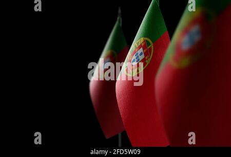 Small national flags of the Portugal on a black background Stock Photo