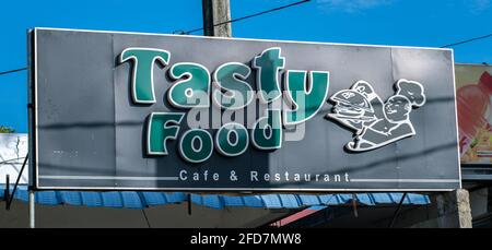 Colombo, Sri Lanka - 03 30 2021: Tasty food restaurant and café name board above the building. Stock Photo