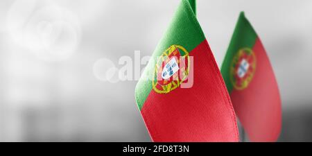 Small national flags of the Portugal on a light blurry background Stock Photo