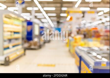 abstract blurred supermarket background. sale, shopping, consumerism - concept Stock Photo