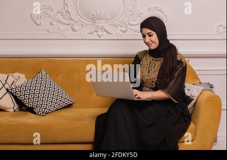 Arab businessman working on laptop computer at home Stock Photo