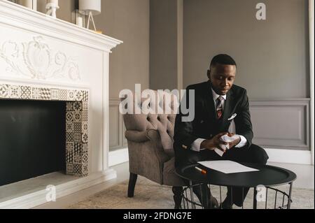 young african american businessman in business suit taking notes Stock Photo