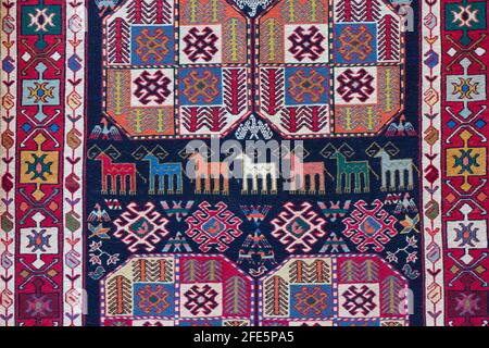 A fragment of national Azerbaijan carpet. Culture of Azerbaijan on the ancient handmade carpet. Stock Photo