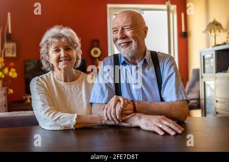 Happy senior couple together at home Stock Photo