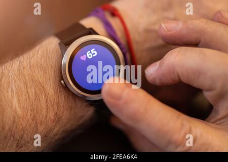 Elderly man hand and detail of the smartwatch Stock Photo