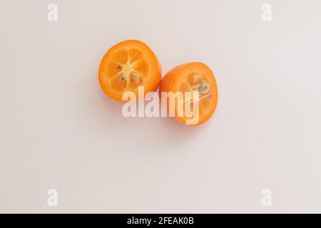 kumquat on white background. exotic fruits Stock Photo
