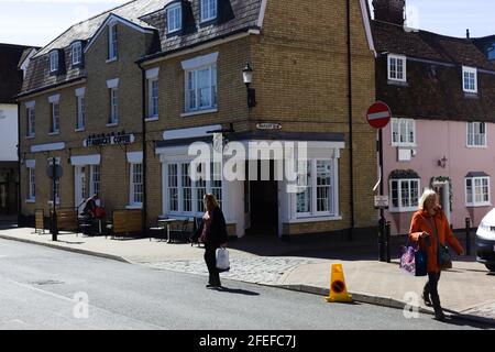 Street view (with people , three women shoppers) near Market Row, Saffron Walden, Essex, Britain Stock Photo