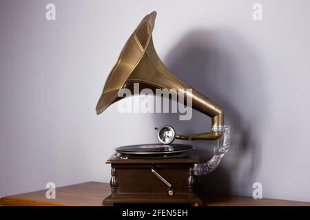Old gramophone with a plate record. Portable wind-up gramophone. Patephone Stock Photo