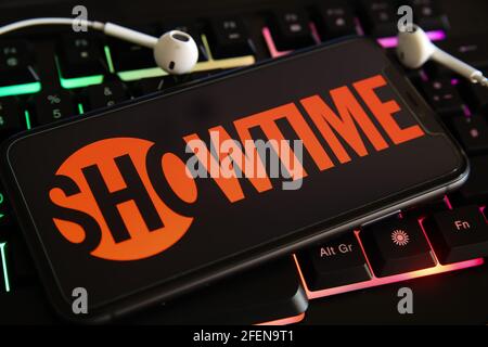Viersen, Germany - March 1. 2021: Closeup of mobile phone screen with logo lettering of streaming service showtime on laptop keyboard Stock Photo