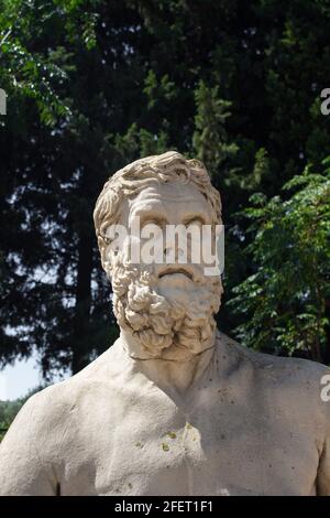 View of Homer's statue at ancient Greek sanctuary on the coast of Ionia called 'Claros'. The ruins are found north of the town Ahmetbeyli in the Mende Stock Photo