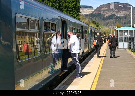 Treherbert, Rhondda Valley, Wales - April 2021: Person catching a train at the terminus station at Treherbert. Stock Photo