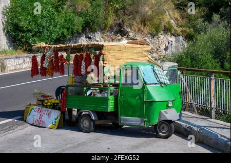 A small mobile sales stand on the roadside in Italy with various types of fruit and vegetables. Stock Photo