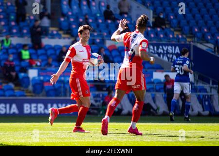 Joe Jacobson of Wycombe Wanderers (L) celebrates scoring his sides first goal from the penalty spot with Garath McCleary of Wycombe Wanderers (R). EFL Skybet championship match, Cardiff city v Wycombe Wanderers at the Cardiff City Stadium in Cardiff, Wales on Saturday 24th April 2021. this image may only be used for Editorial purposes. Editorial use only, license required for commercial use. No use in betting, games or a single club/league/player publications. pic by Lewis Mitchell/Andrew Orchard sports photography/Alamy Live news Stock Photo