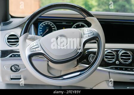 Modern car interior in light colors and navigation device Stock Photo