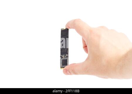 caucasian hand holding NVME M.2 SSD 2280 3Dnand SLC drive stick isolated on white Stock Photo