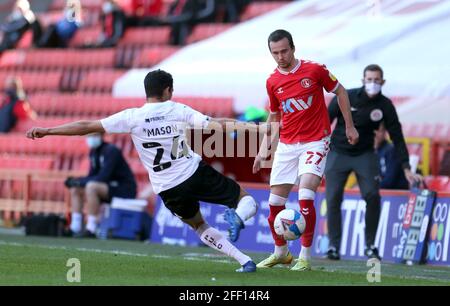 Peterborough United's Niall Mason (left) and Charlton Athletic's Liam Millar (right) battle for the ball during the Sky Bet League One match at The Valley, London. Picture date: Saturday April 24, 2021. Stock Photo