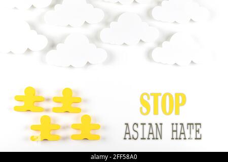 Writing Stop Asian Hate on white background. Poster. Violent attacks in schools, businesses, and other public spaces. Stock Photo