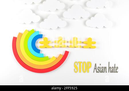 Writing Stop Asian Hate with rainbow on white background. Hate crimes against Asians. Virus has no nationality. Concept of end racism. Stock Photo