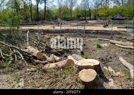 Denham, Buckinghamshire, UK. 24th April, 2021. Two Black Onyx security guards working for HS2 sit in the middle of Denham Country Park next to yet more trees felled by HS2. The High Speed Rail link from London to Birmingham puts 693 wildlife sites, 108 ancient woodlands and 33 SSSIs at risk. Credit: Maureen McLean/Alamy Stock Photo
