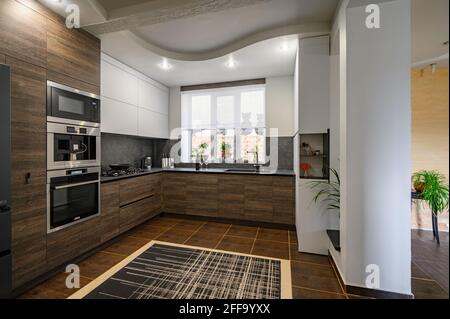 Modern luxurious dark brown, gray and black kitchen details Stock Photo