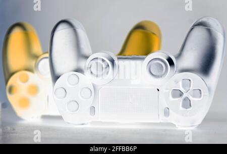 Next generation video game controls stylized on light background. Electronic game accessories. State-of-the-art controllers. Gamer commands. Electroni Stock Photo