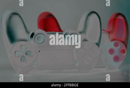 Next generation video game controls stylized on light background. Electronic game accessories. State-of-the-art controllers. Gamer commands. Electroni Stock Photo