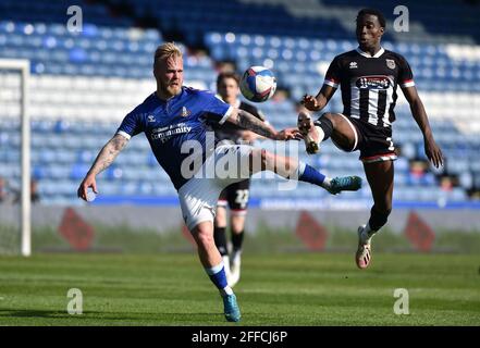 OLDHAM, UK. APRIL 24TH Oldham Athletic's Marcel Hilssner tussles with Jay Matete of Grimsby Town during the Sky Bet League 2 match between Oldham Athletic and Grimsby Town at Boundary Park, Oldham on Saturday 24th April 2021. (Credit: Eddie Garvey | MI News) Credit: MI News & Sport /Alamy Live News Stock Photo
