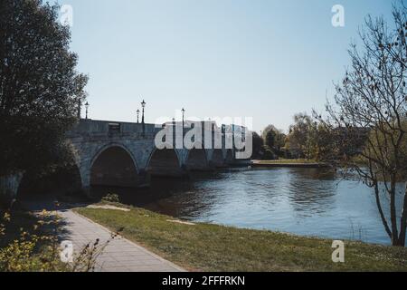 Staines-upon-Thames, Spelthorne  | UK -  2021.04.24: View of the beautiful Chertsey Bridge on warm sunny Spring day Stock Photo