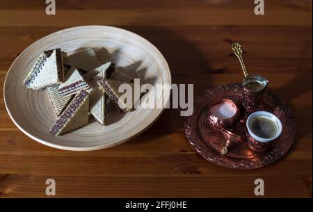 Turkish Coffee in traditional copper pot and cup with waffles. Stock Photo