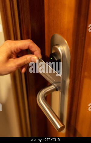Close-up of using the key card to open the door or scanning the key card to open the door of a hotel to enjoy the vacation. Stock Photo