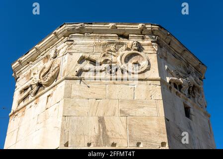Tower of Winds or Aerides close-up, Athens, Greece, Europe. It is old landmark of Athens. Ancient Greek building decorated with relief images in Athen Stock Photo