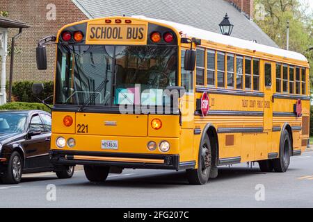 Easton, MD, USA 04-16-2021: A yellow Thomas School bus operated by Talbot County Public School district in Maryland, is on the road after school dismi Stock Photo