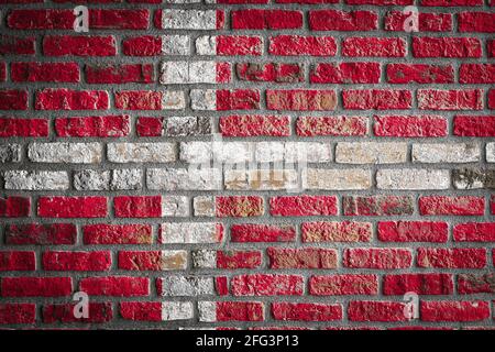 National flag of Denmark depicting in paint colors on an old brick wall ...