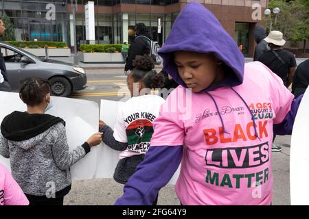 Columbus, United States. 24th Apr, 2021. Children hold placards during the demonstration.Black Lives Matter activists gathered in front of the Ohio Statehouse to protest against the police killing of a 16 year old Ma'Khia Bryant this past Tuesday in Columbus, Ohio. The protest was named “Show your CROCS for Ma'Khia Bryant!” because Bryant was shot and killed while wearing Croc shoes. Credit: SOPA Images Limited/Alamy Live News Stock Photo