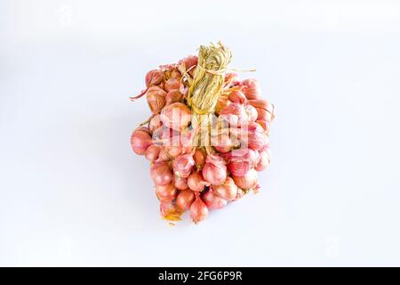 Asian shallot is a type of onion, it is a small bulb size, isolated on white background Stock Photo