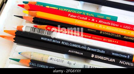 Some famous names in art pencils: colouring pencils lined up in the artist's tray Stock Photo
