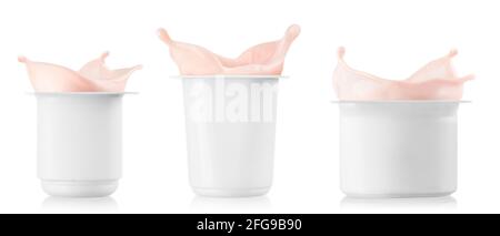 set of three plastic cups with splashing yogurt Stock Photo