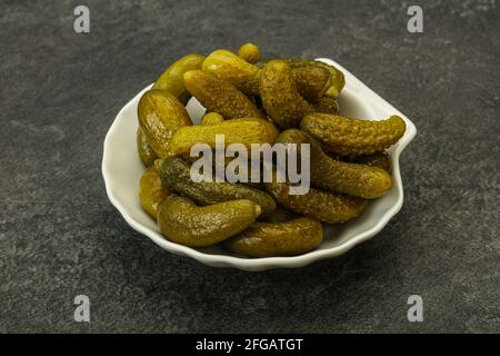 Pickled young gherkin in the bowl Stock Photo