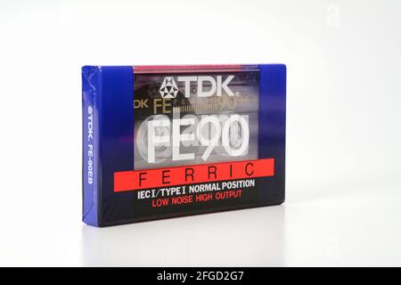 PRAGUE, CZECH REPUBLIC - NOVEMBER 29, 2018: Audio compact cassette TDK FE 90 Ferric. Audio cassette on a white background, left front view. analog for Stock Photo