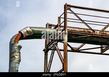 Abandoned industrial complex, rusted and broken pipes and construction Stock Photo