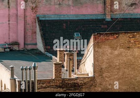 Chimneys and antennas on the roof of the urban building Stock Photo