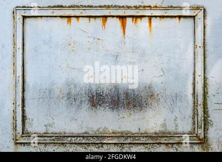 White painted grungy rusty metal frame with rivets for background Stock Photo