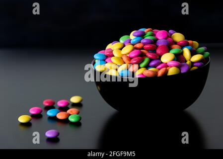 A bowl full of colorful round candies Stock Photo
