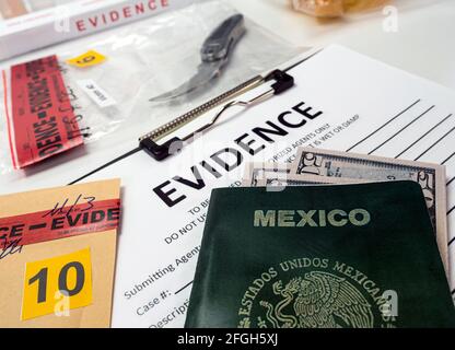 Mexican passport next to evidence bag in crime lab, concept image Stock Photo