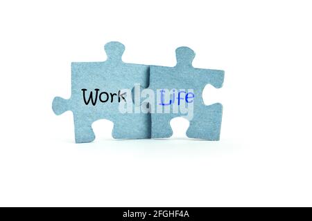 Work and life. Two blue puzzles on white background. Balance and choice concept Stock Photo