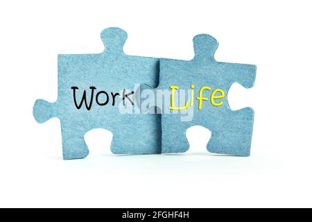 Work and life. Two blue puzzles on white background. Balance and choice concept Stock Photo