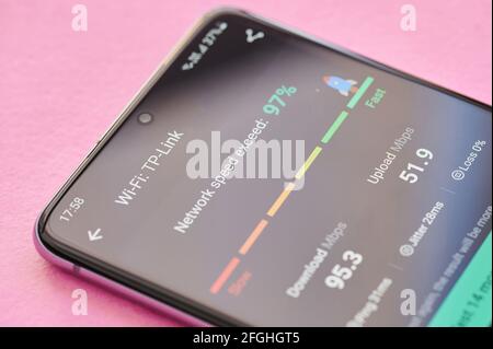 New york, USA - April 23, 2021: Results of internet speed test on smartphone screen macro close up view Stock Photo