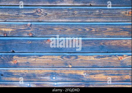 wooden boards background. aged burned black and blue wooden planks Stock Photo